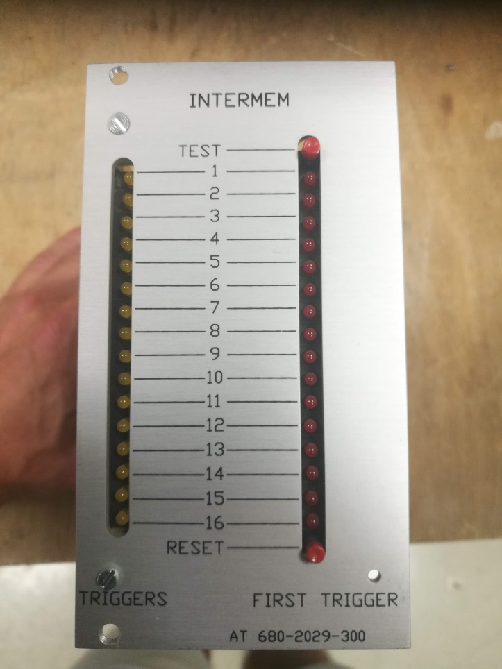 Figure 11 (original): InterMem front panel, with the TEST and RESET buttons, the TRIGGERS column (yellow LEDs) and the FIRST TRIGGER column (red LEDs).
